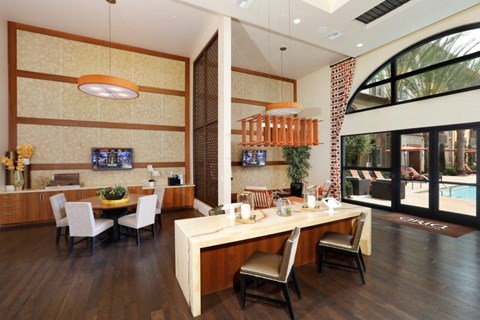 a dining room and living room with a table and chairs